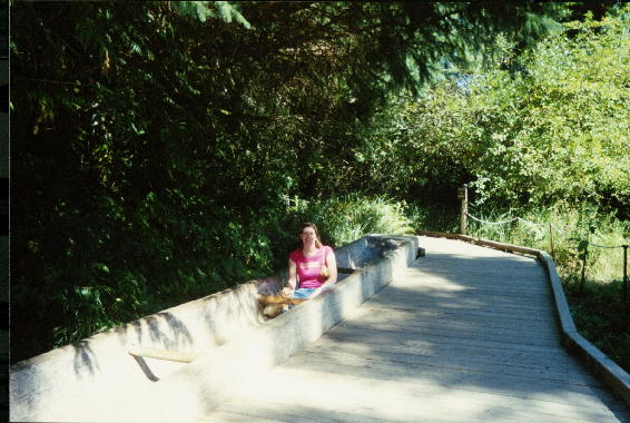 Mary steers a canoe.