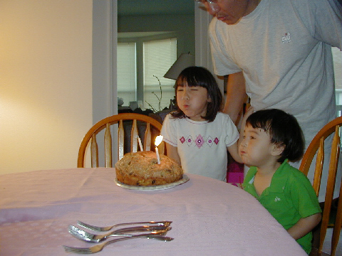 Everyone helps blow out the candles.