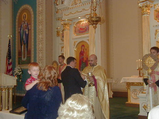 Michael receives the Eucharist for the first time.