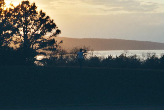 Mary admires an Arkansas sunset.