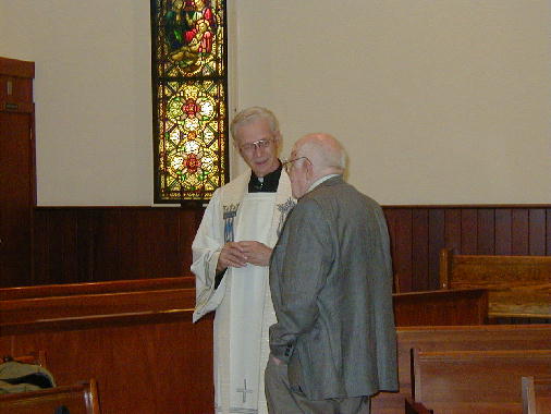 Pop Pop Pop talking with Father Berger.